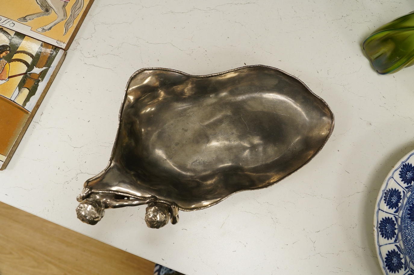 A WMF style plated pewter figural dish, stamped L.W.E.P. to base, 35cm wide. Condition - fair to good